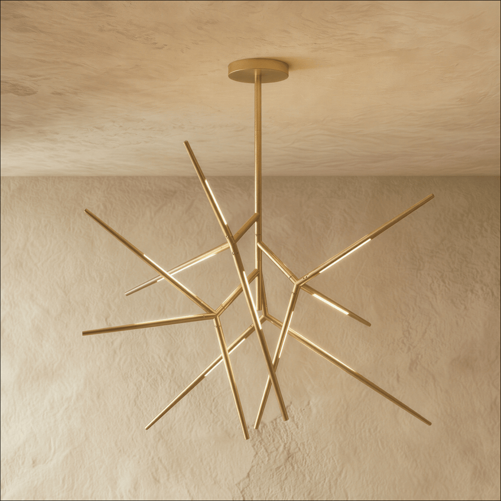 A gold sputnik chandelier whose lit arms radiate in every direction from one hub