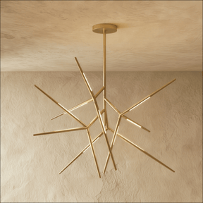 A gold sputnik chandelier whose lit arms radiate in every direction from one hub