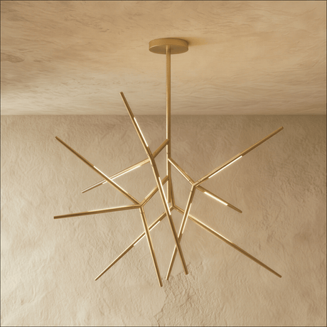 A gold sputnik chandelier whose lit arms radiate in every direction from one hub
