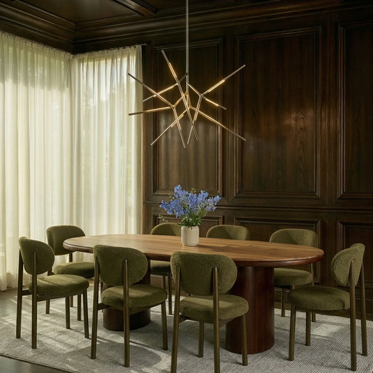 The gold version above a dining table and chairs in a dark wood paneled room with curtains
