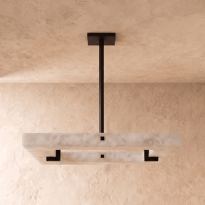 A square alabaster panel lit, with a black square inset and a black stem