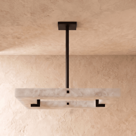 A square alabaster panel lit, with a black square inset and a black stem