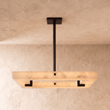 The same square panel unlit, pale stone with a black frame set inside it