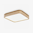 Square flush mount ceiling light with a travertine frame and a white light panel