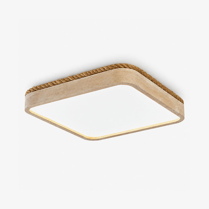 Square flush mount ceiling light with a travertine frame and a white light panel