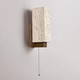 The block seen at an angle showing the wood bracket carrying it clear