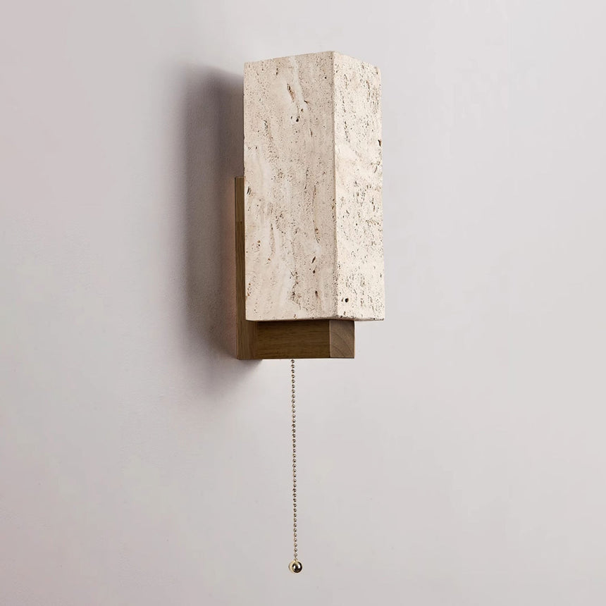 The block seen at an angle showing the wood bracket carrying it clear