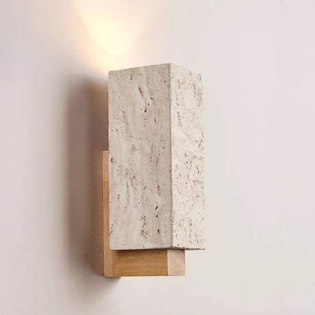 The block lit on a wall, a soft fan of light thrown up onto the plaster