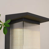 Close view of the flat black cap over the lit ribbed body
