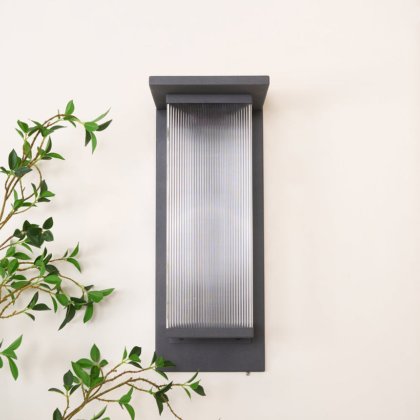 Front view of the unlit lantern, the clear ribbed panel in the black frame