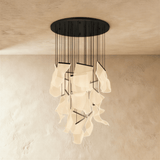 The same long cascade of lit sheets hung from a round black ceiling canopy