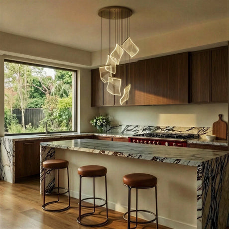 The cascade over a kitchen counter with stools and a window onto the garden