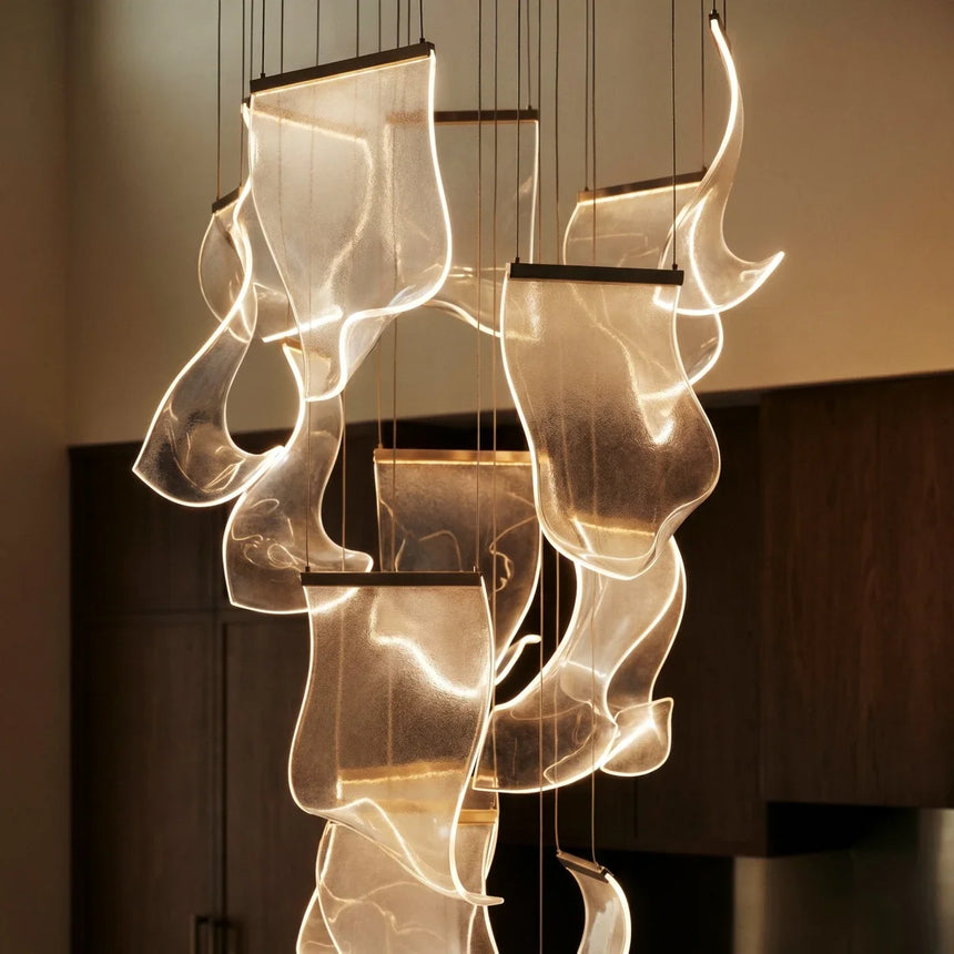 Several curved sheets lit from their edges so the acrylic glows along each curve