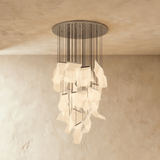 The same long cascade of lit sheets hung from a round silver ceiling canopy