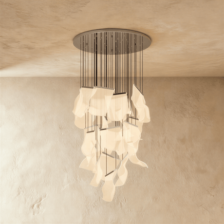 The same long cascade of lit sheets hung from a round silver ceiling canopy