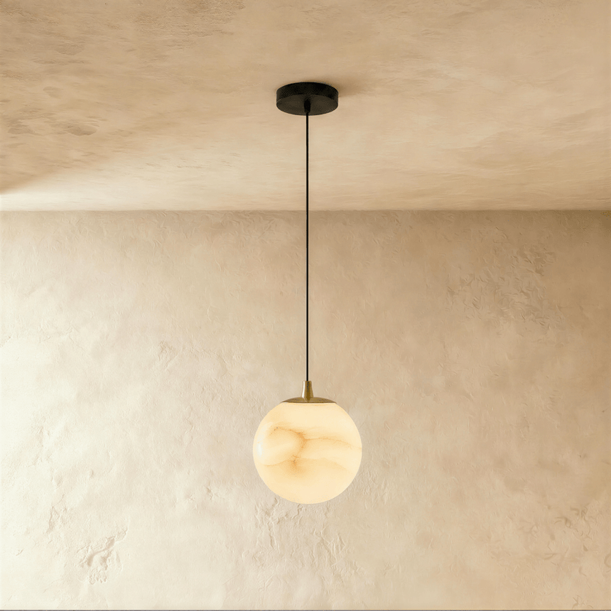 One lit alabaster sphere on a black cord below a small black ceiling plate