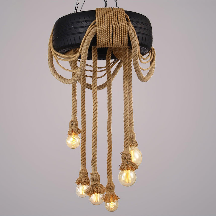 The chandelier lit in full, every strand and lamp visible