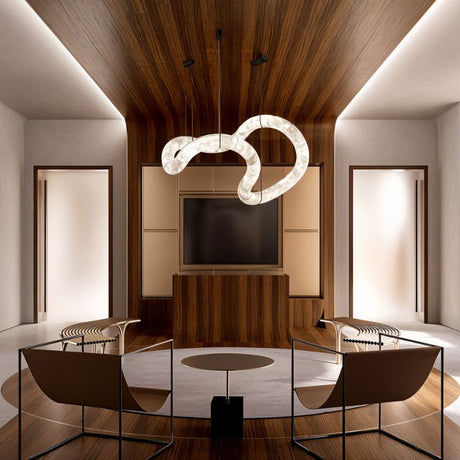 The lit stone tube above a round table and chairs under a timber ceiling