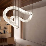 The lit tube in a room with timber shelving and a tall mirror on the wall