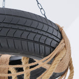 The rubber tire and the hemp rope binding it, seen at close range
