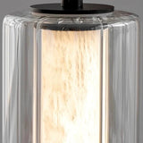 Close view of the clear glass sleeve around the lit marble column