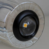 Close view of the LED set into the top of the glass cylinder