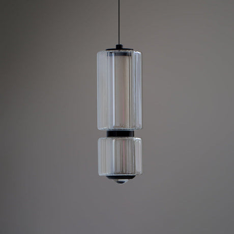 Close view of the lit marble sections stacked inside the glass tube
