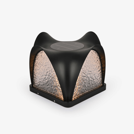 Sculpted cap with four curved petals over textured lit panels
