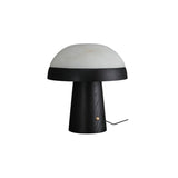 Stone table lamp with a black base against a plain ground