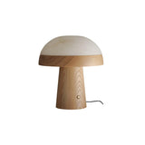 Stone table lamp with a walnut base against a plain ground