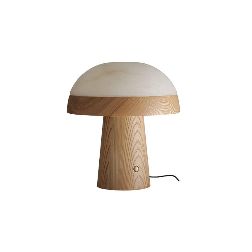 Stone table lamp with a walnut base against a plain ground