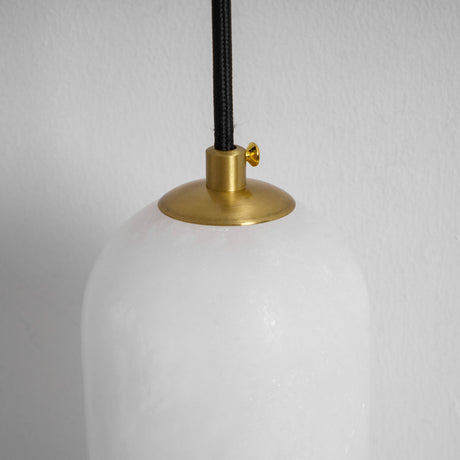 Close view of the brass cap holding the top of the stone shade
