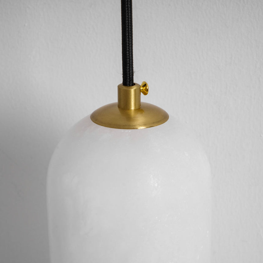 Close view of the brass cap holding the top of the stone shade