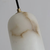 Close view of the carved stone shade and its brown veining