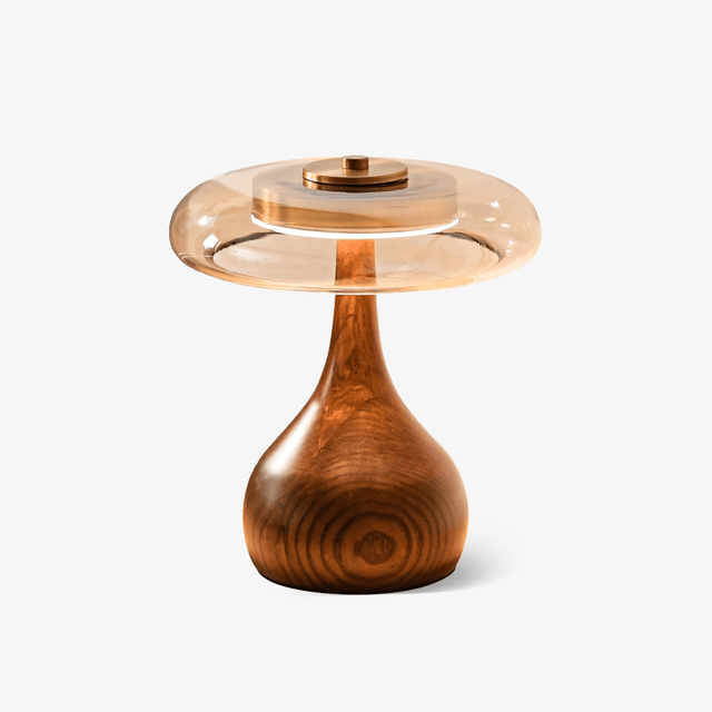 Table lamp with an amber glass shade on a curved walnut base, plain ground