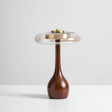 The tall glass shade table lamp seen from the front, plain pale ground
