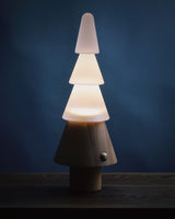 Table lamp with night light lit against a deep blue background