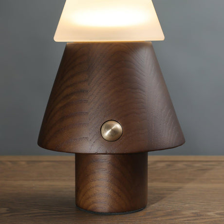 Close view of the turned wood cone base and its brass button