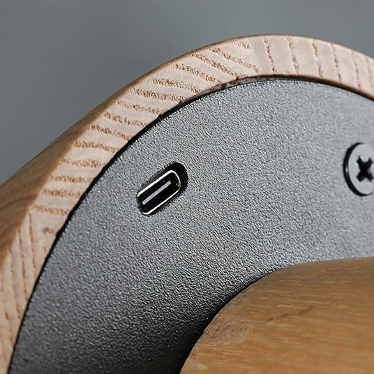 Close view of the Type-C charging port under the wooden base