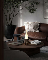 Table lamp with night light lit on a coffee table in a living room