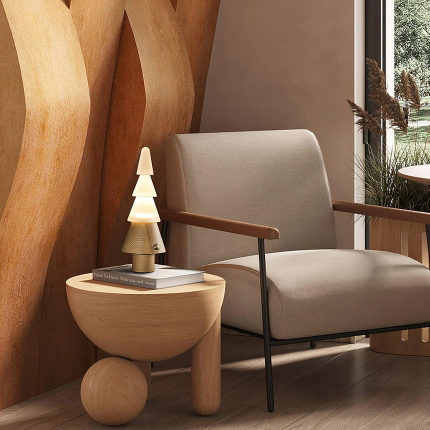 Table lamp with night light lit on a rounded wooden side table
