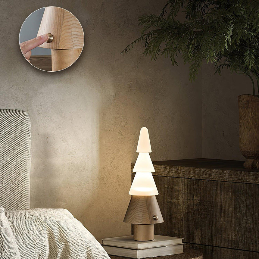 Table lamp with night light lit on a ledge beside a round mirror