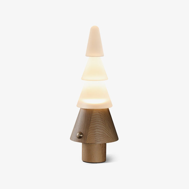 Table lamp with night light shaped as a lit stacked tree, plain ground