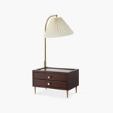 Table lamp with storage, a wood case with two drawers and a pleated shade on a brass arch