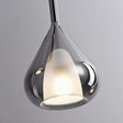 Close view of the lit teardrop with the inner opal cup showing through the glass