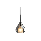The teardrop shade lit from inside with the glass reading smoked at the top