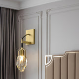 The crystal drop lit on a paneled wall beside a channel tufted headboard and curtains