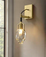 The crystal drop lit on a pale wall beside a tall window