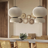 Row of textured pendants above a dining table