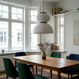 Textured pendant above a table in a bay window room